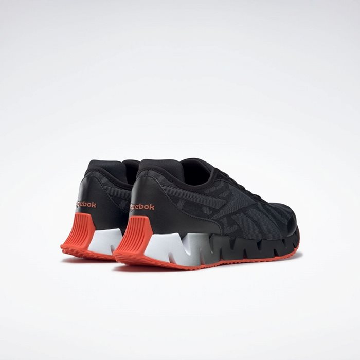 נעלי ריצה לבוגרים בצבע שחור/לבן דגם ZIG DYNAMICA מבית REEBOK